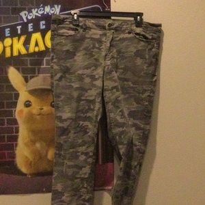 These are camo pants they have a little rips in them and they’re women’s